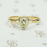 stunning .65ct old mine cut pear shaped diamond in 14k yellow recycled gold