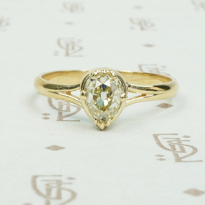 stunning .65ct old mine cut pear shaped diamond in 14k yellow recycled gold