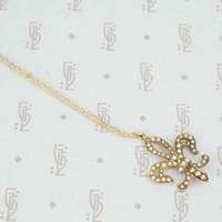 gold fleur de lis pendant set with pearls