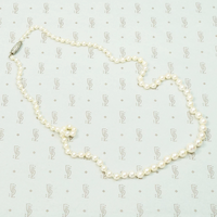 20" long graduated pearls with a Platinum and old mine cut diamond clasp