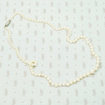 20" long graduated pearls with a Platinum and old mine cut diamond clasp