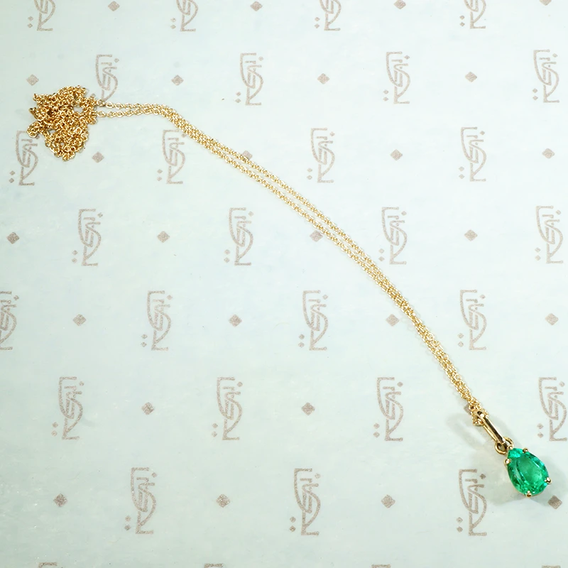 brilliant green columbian emerald pear shaped pendant in recycled 14k yellow gold1.03ct