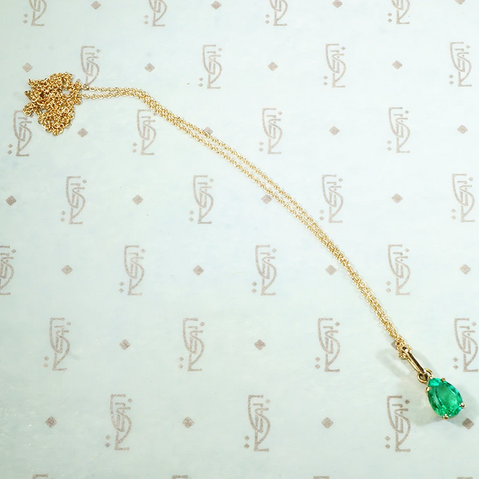 brilliant green columbian emerald pear shaped pendant in recycled 14k yellow gold1.03ct