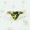 green peridot heart ring in recycled 14k yellow gold