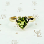 green peridot heart ring in recycled 14k yellow gold
