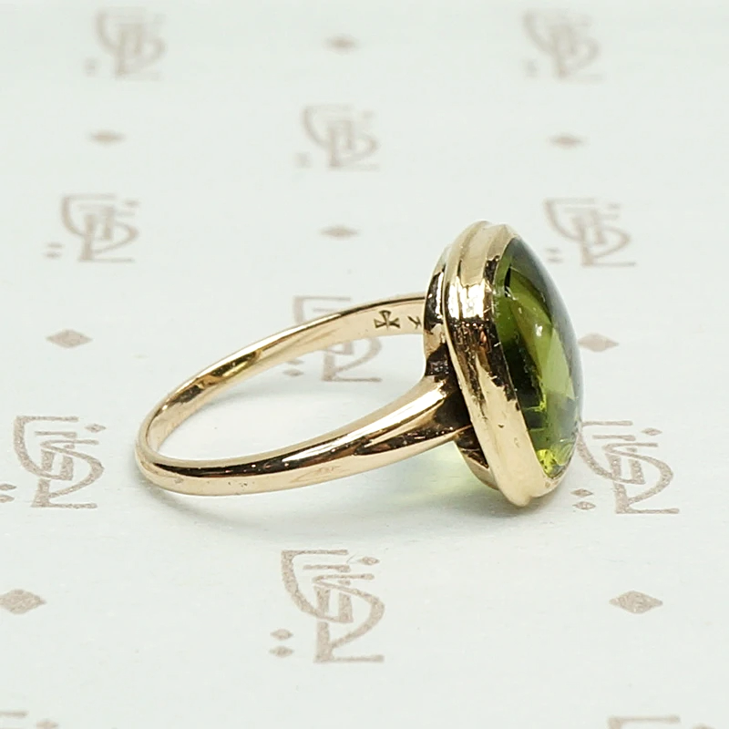Otsby and Barton Buff Top Peridot Ring