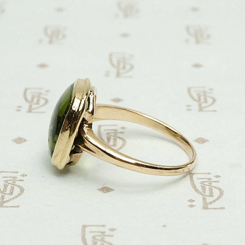 Otsby and Barton Buff Top Peridot Ring