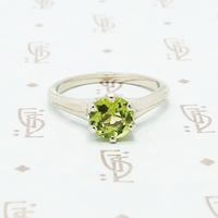 1 carat green peridot solitaire in recycled white gold