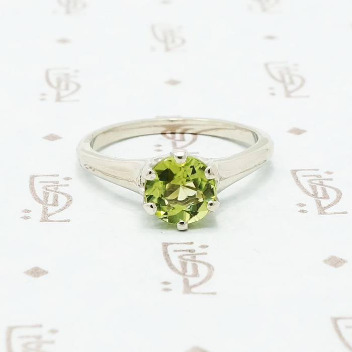 1 carat green peridot solitaire in recycled white gold