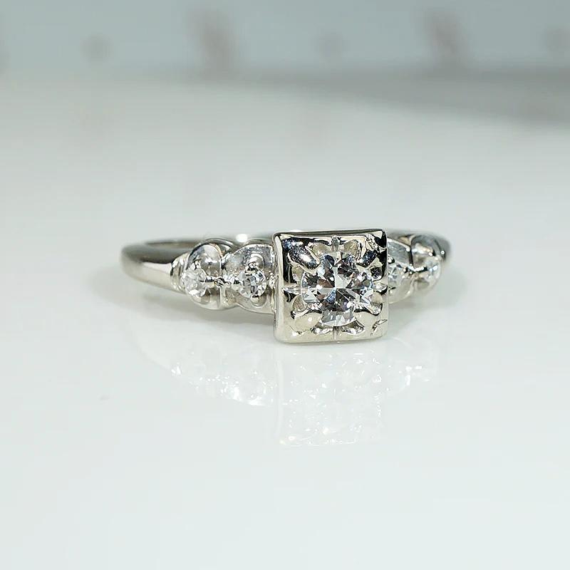 Romantic White Gold Engagement Ring with Floral Details