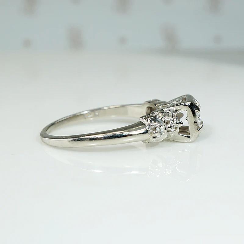 Romantic White Gold Engagement Ring with Floral Details