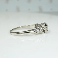 Romantic White Gold Engagement Ring with Floral Details