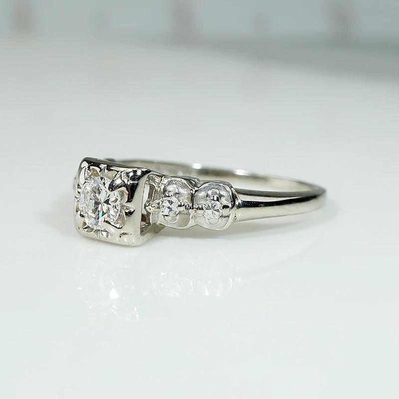 Romantic White Gold Engagement Ring with Floral Details