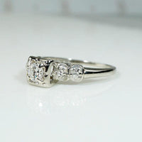 Romantic White Gold Engagement Ring with Floral Details