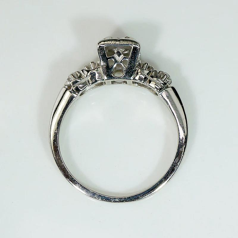 Romantic White Gold Engagement Ring with Floral Details