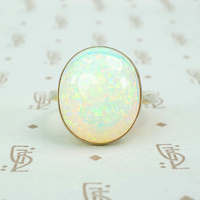 8 carat pinfire opal ring in platinum and 18k yellow gold. 