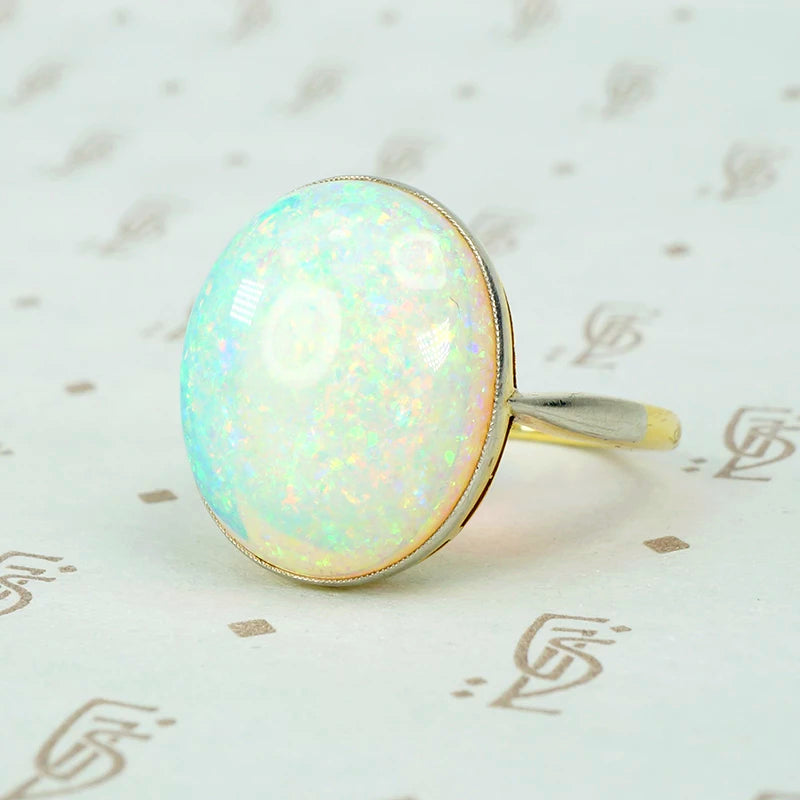 8 carat pinfire opal ring in platinum and 18k yellow gold. 