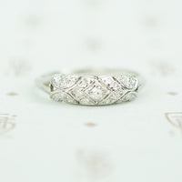 edwardian open work platinum millgrain edged diamond band ring