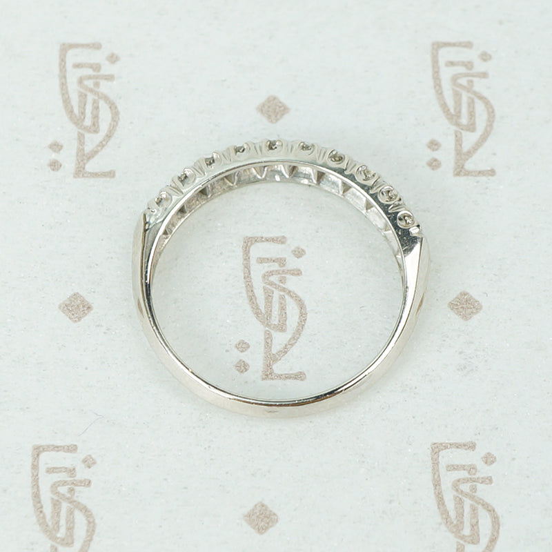1940's 10 diamond wedding band in platinum with knife edge band top side view