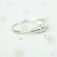 side view of rounded tapered band on edwardian platinum filigree diamond band ring