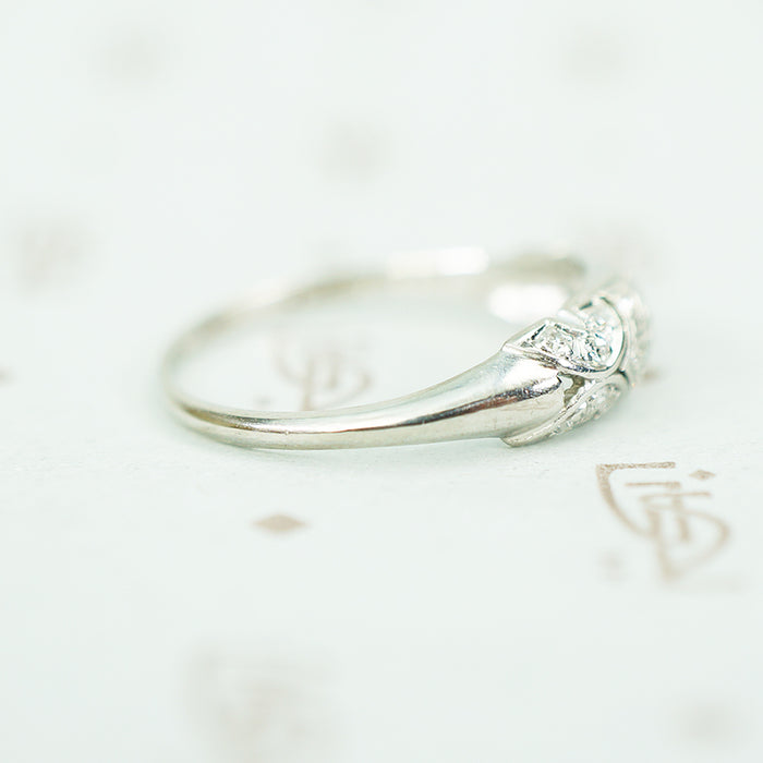 side view of rounded tapered band on edwardian platinum filigree diamond band ring