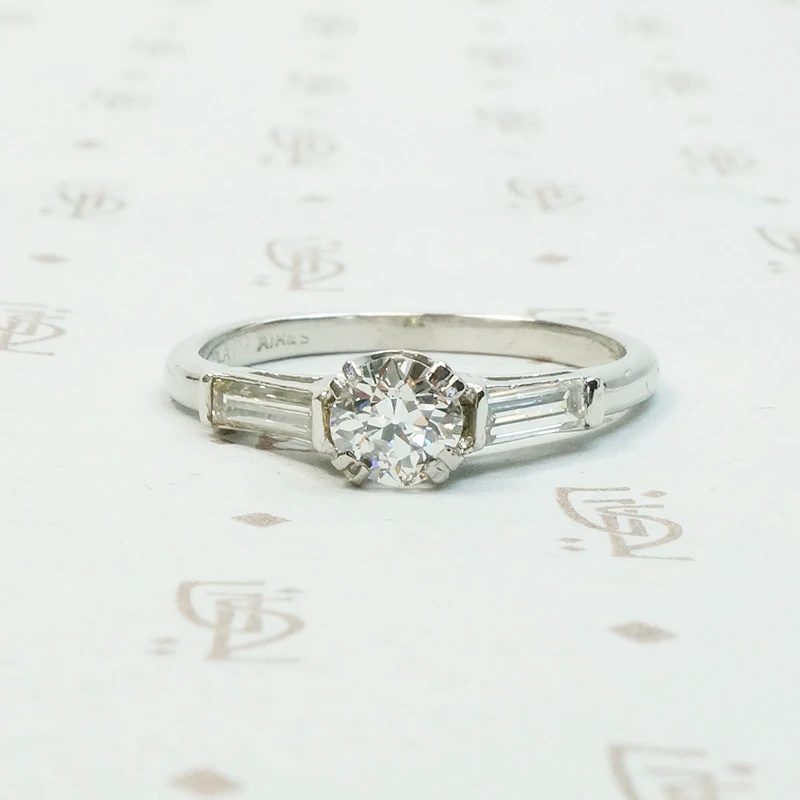 Platinm Engagemenrt ring set with .49carat oec diamond with baguette side stones circa 1940