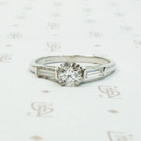 Platinm Engagemenrt ring set with .49carat oec diamond with baguette side stones circa 1940