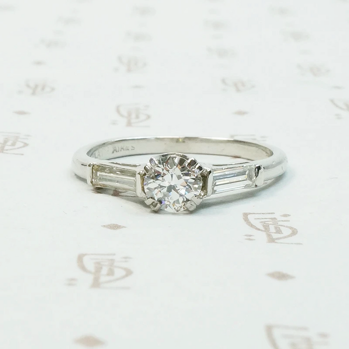 Platinm Engagemenrt ring set with .49carat oec diamond with baguette side stones circa 1940