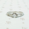 Platinm Engagemenrt ring set with .49carat oec diamond with baguette side stones circa 1940