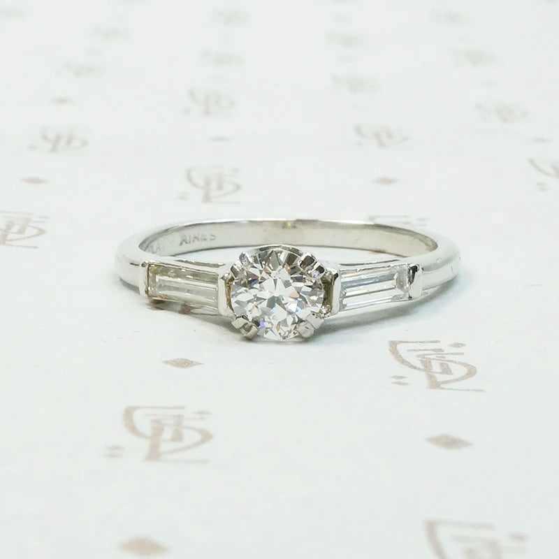 Platinm Engagemenrt ring set with .49carat oec diamond with baguette side stones circa 1940