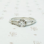 Platinm Engagemenrt ring set with .49carat oec diamond with baguette side stones circa 1940