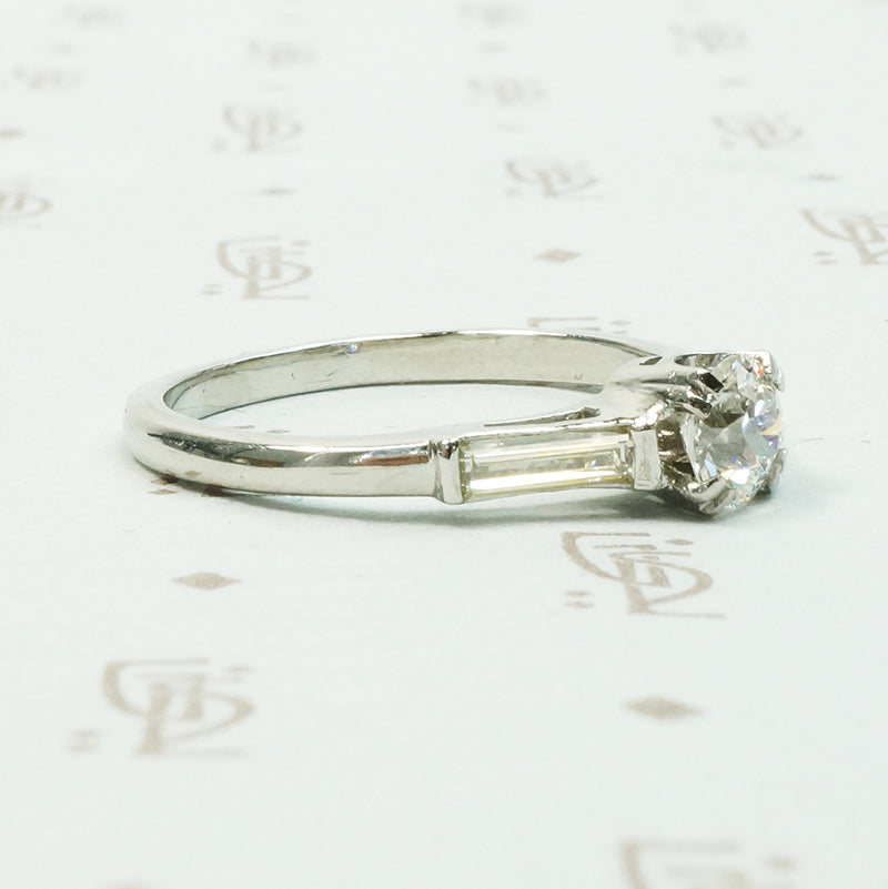 Platinm Engagemenrt ring set with .49carat oec diamond with baguette side stones circa 1940