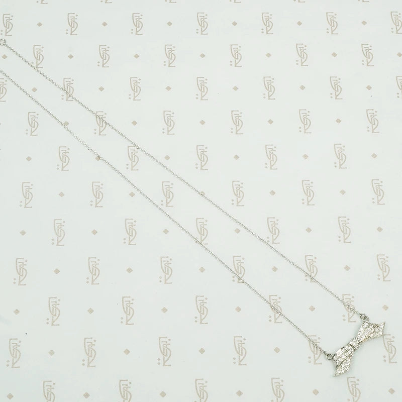 Pavé diamond platinum bow necklace
