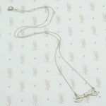 Pavé diamond platinum bow necklace