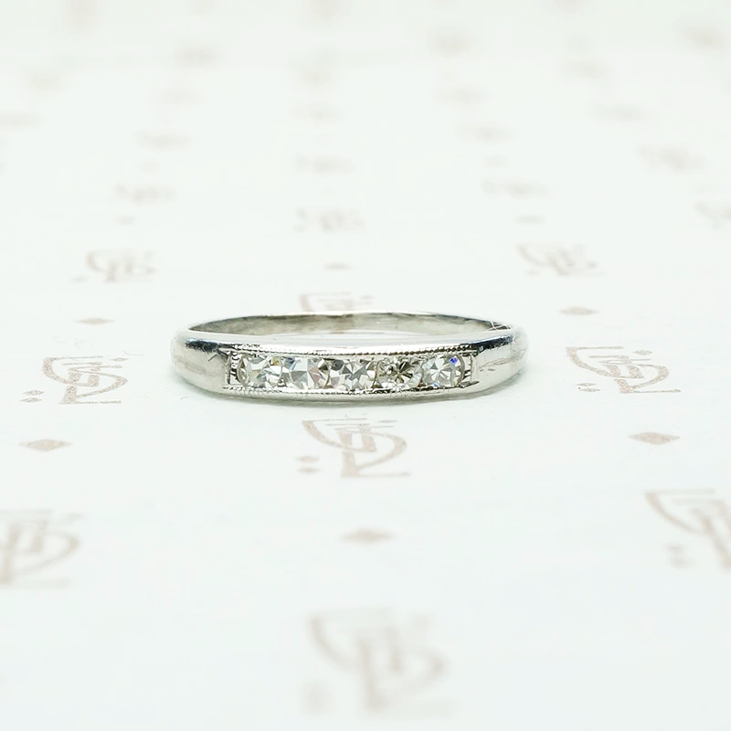 5 diamond channel set platinum wedding band