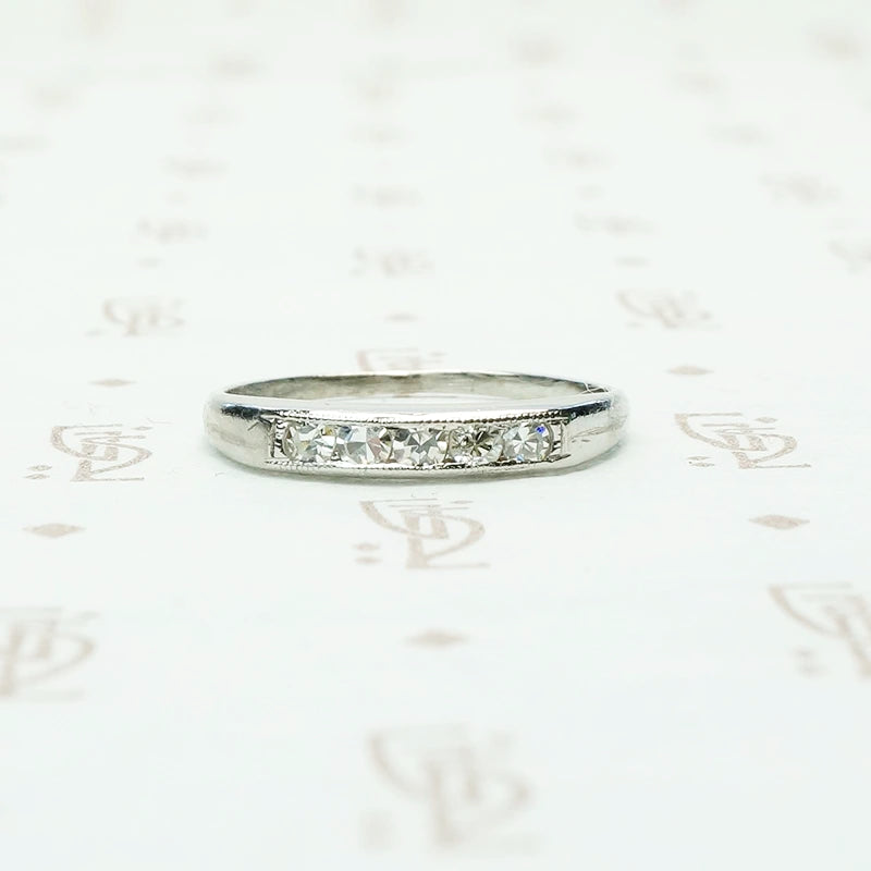 5 diamond channel set platinum wedding band