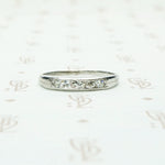 5 diamond channel set platinum wedding band
