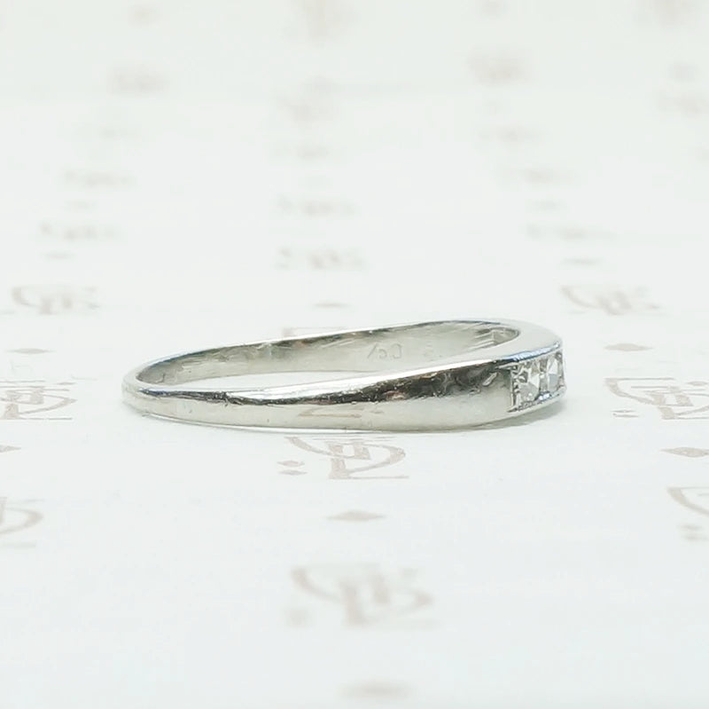 5 diamond channel set platinum wedding band