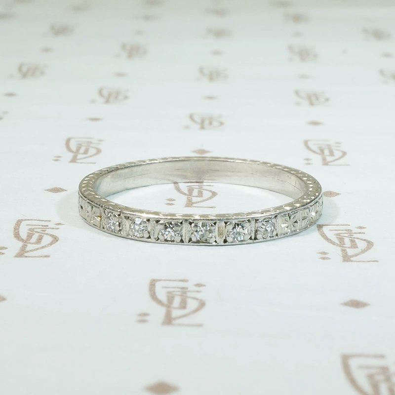 engraved platinum and 6 diamond band forget me not flowers are engraved all the way round