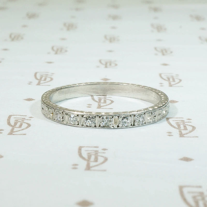 engraved platinum and 6 diamond band forget me not flowers are engraved all the way round