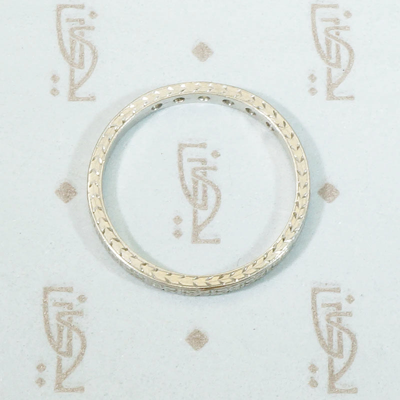 engraved platinum and 6 diamond band forget me not flowers are engraved all the way round