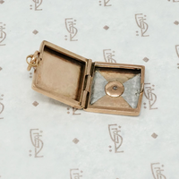 platinum and rose gold locket with omc diamond open