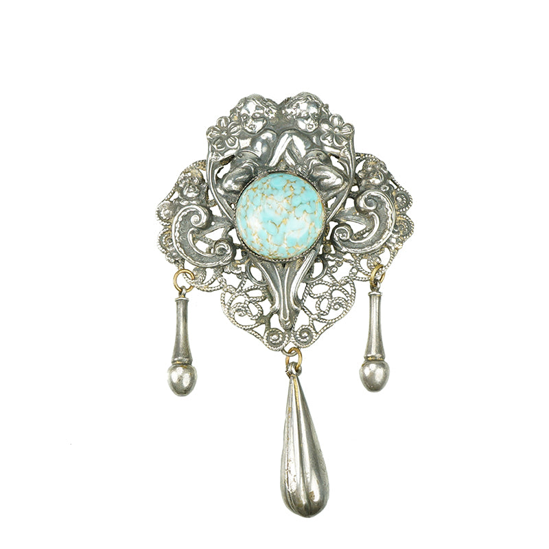 Style Metal Spec. NY. Brooch with cherubs
