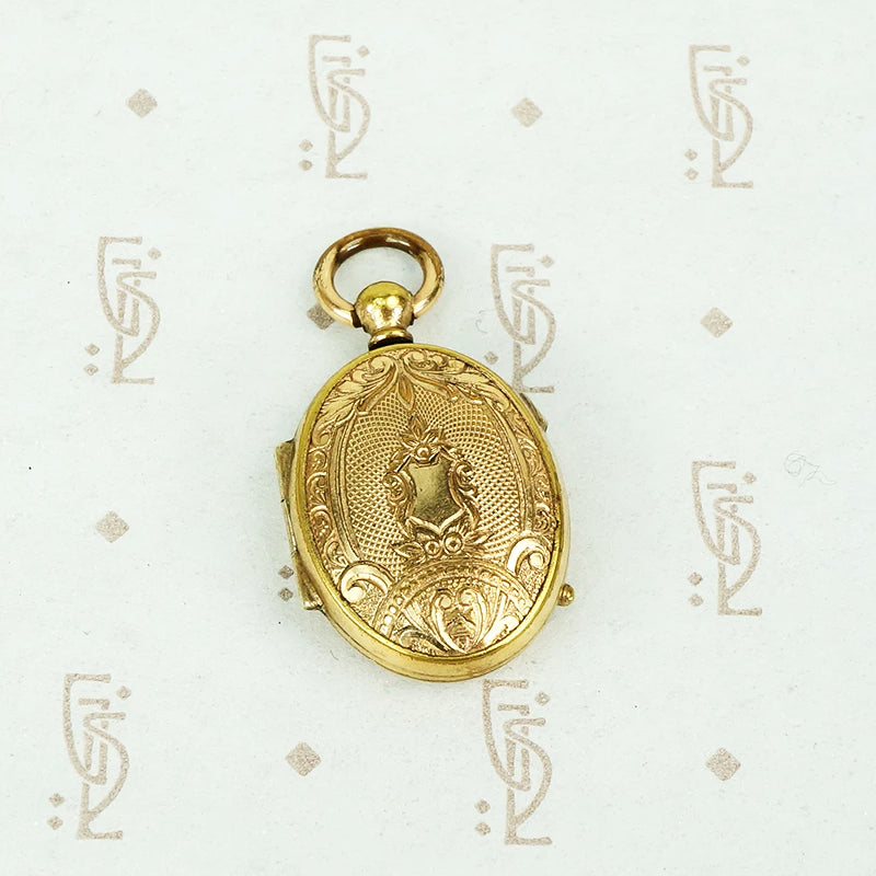 oval pocket watch style locket gold front and back