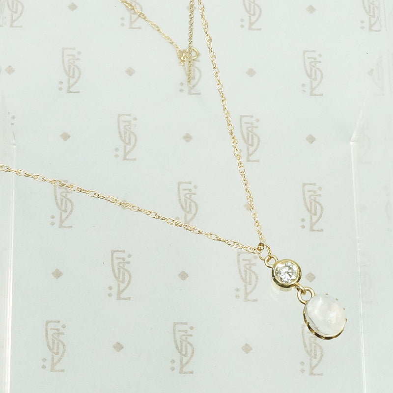 vintage moonstone and diamond gold pendant on a chain