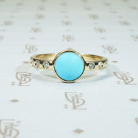 sleeping beauty turquoise in 14k recycled yellow gold with diamond sides