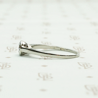 1920s White Gold Bezel Set Diamond Solitaire. Left View.
