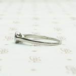 1920s White Gold Bezel Set Diamond Solitaire. Left View.