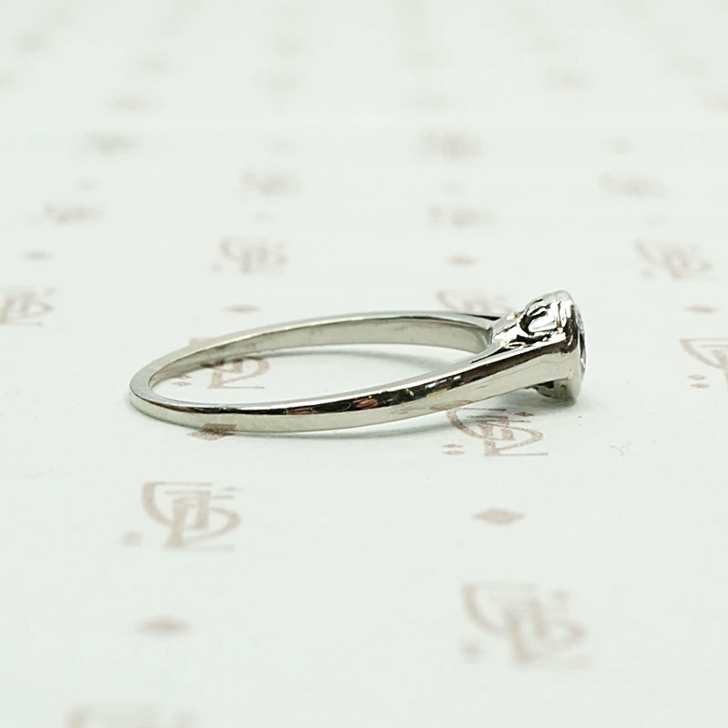 1920s White Gold Bezel Set Diamond Solitaire. Right view.