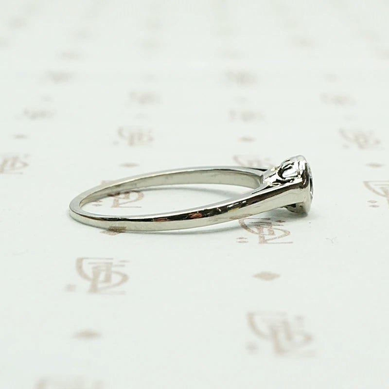 1920s White Gold Bezel Set Diamond Solitaire. Right view.